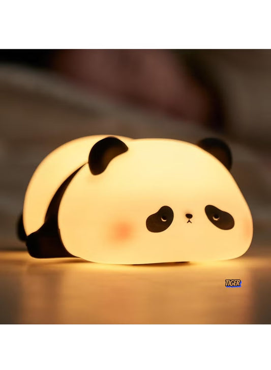Panda-shaped night light with a soft glow on a blurred background